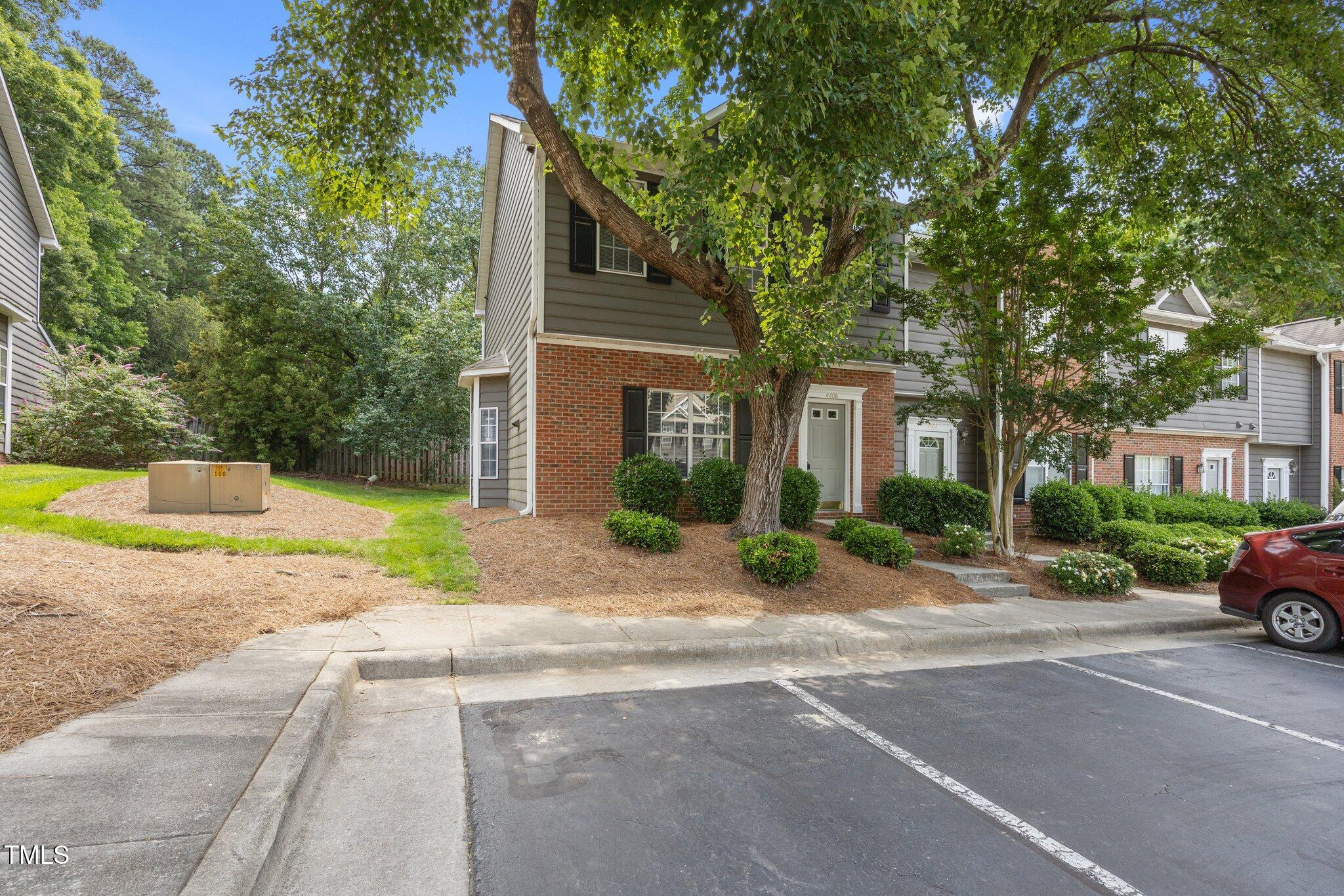 4406 Still Pines Drive Raleigh, NC 27613 - Photo 3 of 39 a building with trees in front of it
