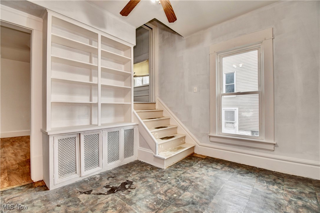 813 Dayton Street Akron, OH 44310 - Photo 15 of 29 Stairs featuring baseboards and ceiling fan