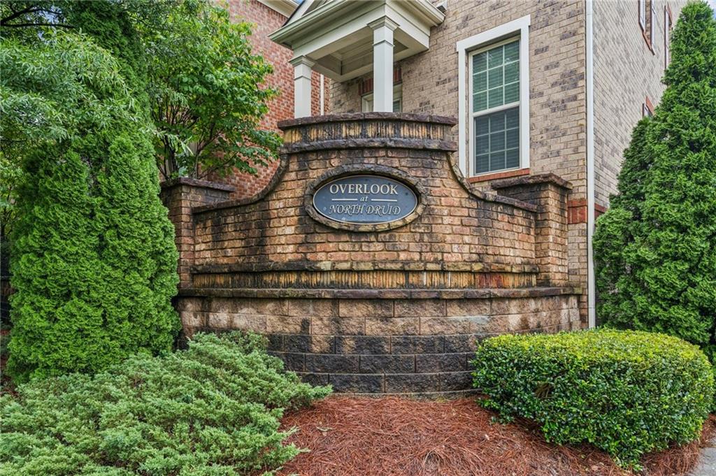 1514 Woodbridge Way Northeast Atlanta, GA 30329 - Photo 13 of 54 a front view of a house with garden