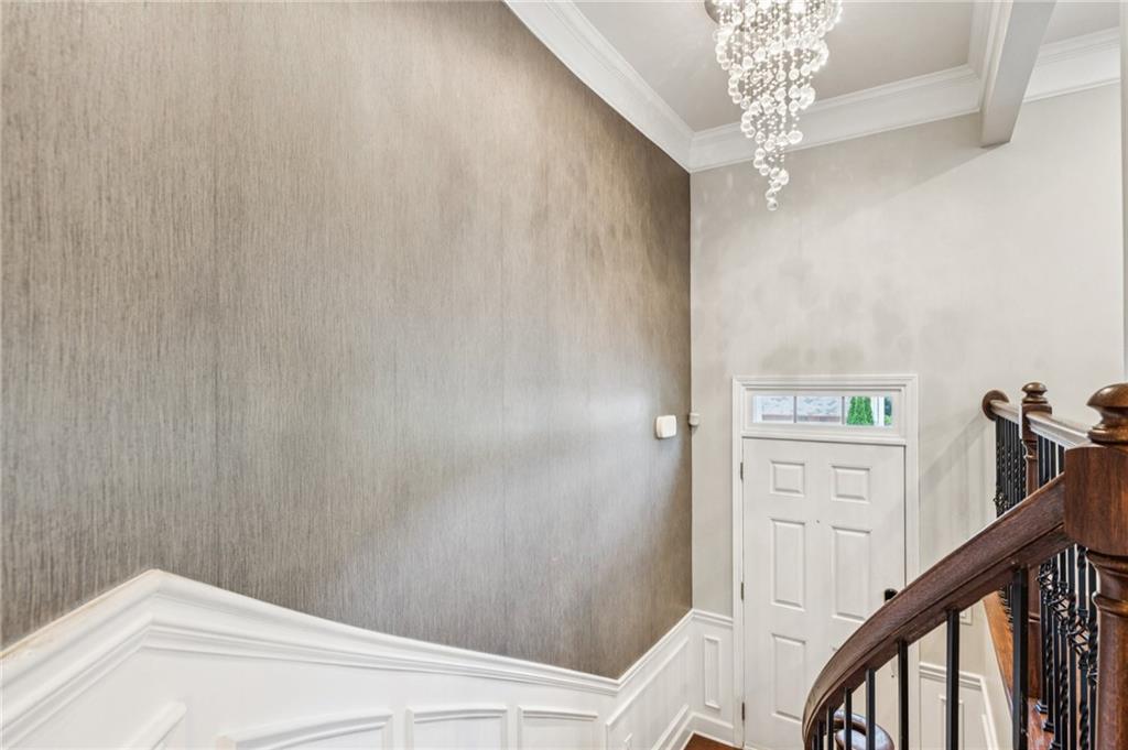 1514 Woodbridge Way Northeast Atlanta, GA 30329 - Photo 14 of 54 a view of a hallway with chandelier