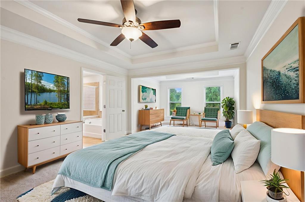 1514 Woodbridge Way Northeast Atlanta, GA 30329 - Photo 29 of 54 a bedroom with a large bed and a flat tv screen on dresser