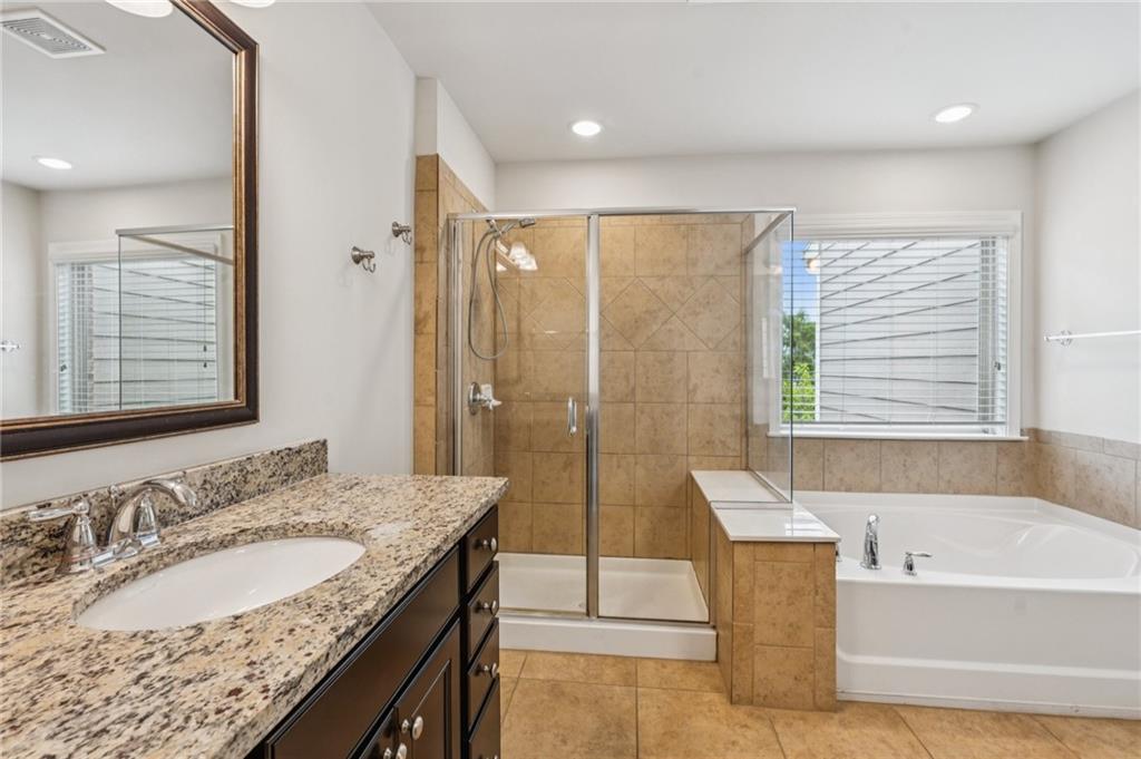 1514 Woodbridge Way Northeast Atlanta, GA 30329 - Photo 34 of 54 a bathroom with a granite countertop tub sink and mirror