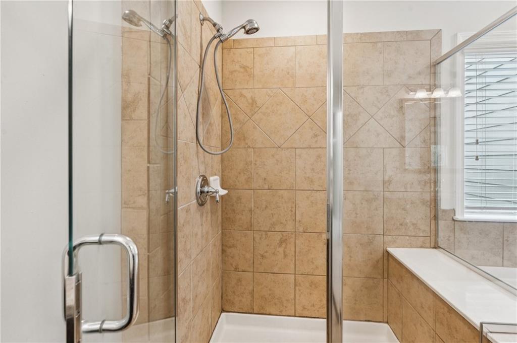 1514 Woodbridge Way Northeast Atlanta, GA 30329 - Photo 35 of 54 a bathroom with a sink a toilet and shower