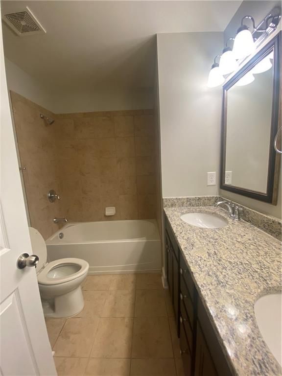 1514 Woodbridge Way Northeast Atlanta, GA 30329 - Photo 41 of 54 a bathroom with a granite countertop sink toilet and shower