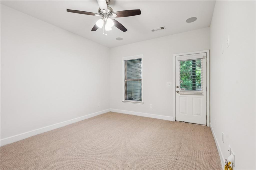 1514 Woodbridge Way Northeast Atlanta, GA 30329 - Photo 44 of 54 an empty room with a window and a fan