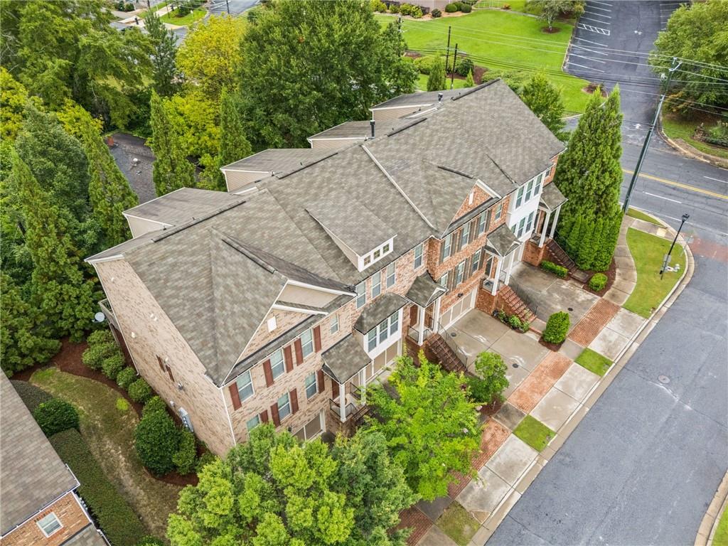 1514 Woodbridge Way Northeast Atlanta, GA 30329 - Photo 5 of 54 an aerial view of a house with a yard and potted plants
