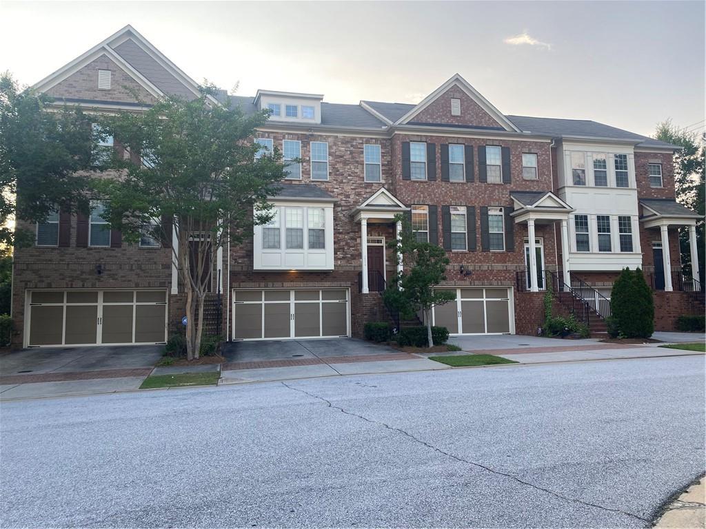 1514 Woodbridge Way Northeast Atlanta, GA 30329 - Photo 9 of 54 a front view of a house with a garden