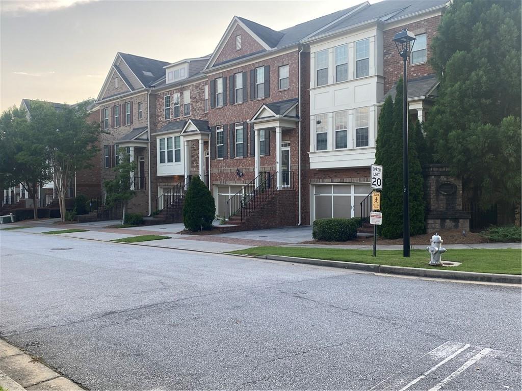 1514 Woodbridge Way Northeast Atlanta, GA 30329 - Photo 10 of 54 a front view of a house with a yard
