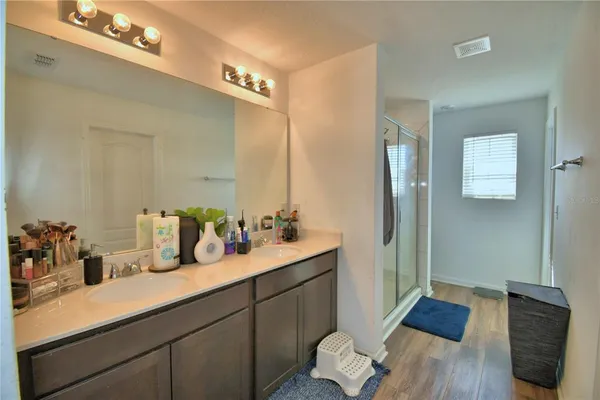 a bathroom with a shower and a sink