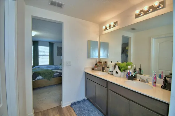 a living room with furniture toys and a flat screen tv