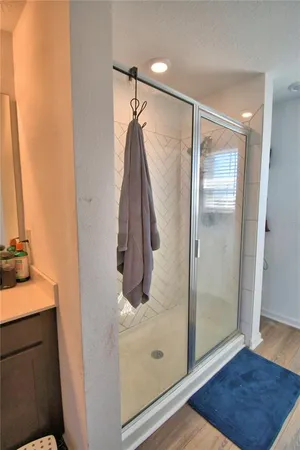 a bathroom with a sink mirror vanity and toilet