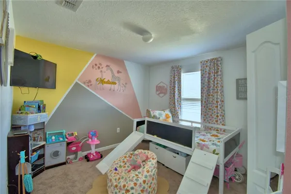 a swimming pool with outdoor seating and yard