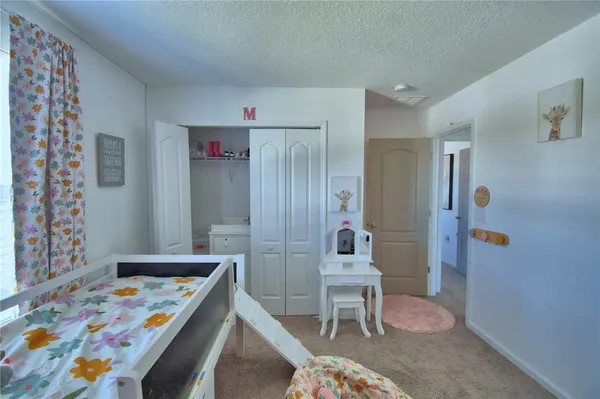 a front view of house with outdoor seating and yard