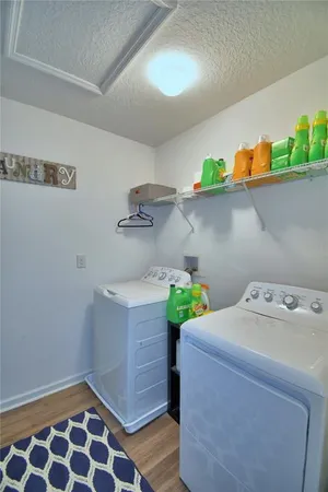 a view of a house with a yard and garage