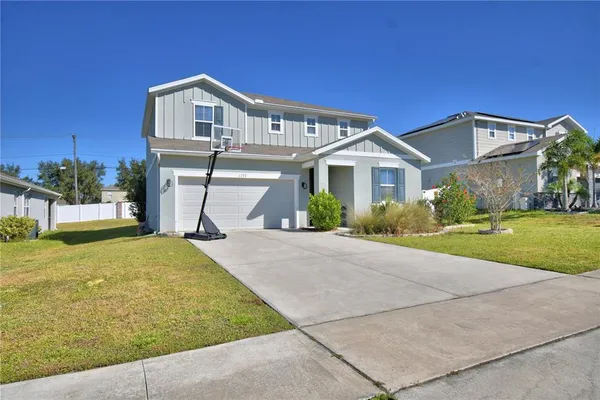 a front view of a house with yard