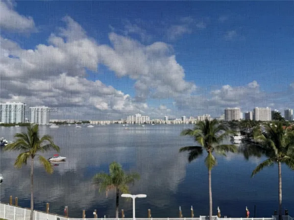 a view of a lake with a yard