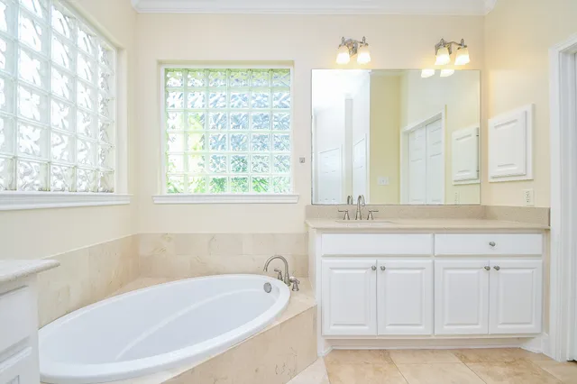 a bathroom with a bathtub and a sink