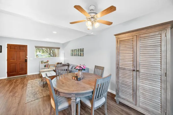 a kitchen with cabinets and steel appliances