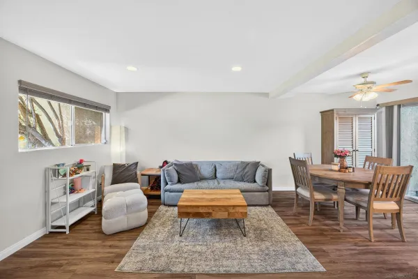 a living room with furniture and a rug