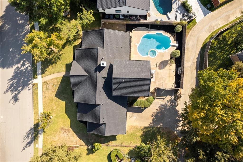 an aerial view of houses with outdoor space