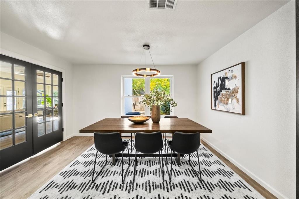 3609 Hidalgo Street Irving, TX 75062 - Photo 14 of 40 a view of a dining room with a table and chairs