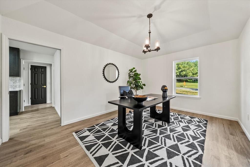 3609 Hidalgo Street Irving, TX 75062 - Photo 16 of 40 a view of a dining room with furniture window and wooden floor