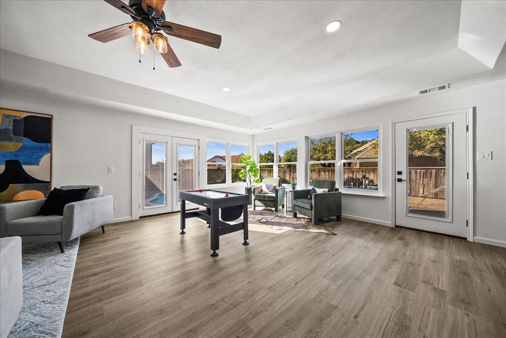 3609 Hidalgo Street Irving, TX 75062 - Photo 23 of 40 a living room with furniture and a wooden floor