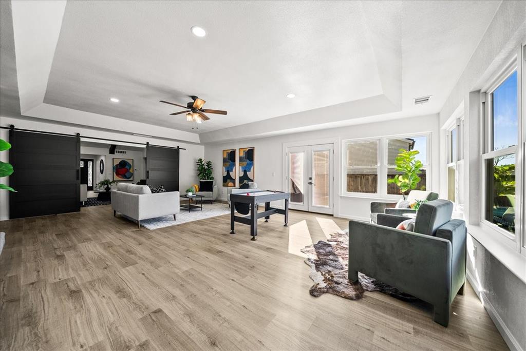 3609 Hidalgo Street Irving, TX 75062 - Photo 24 of 40 a living room with furniture and a table with wooden floor