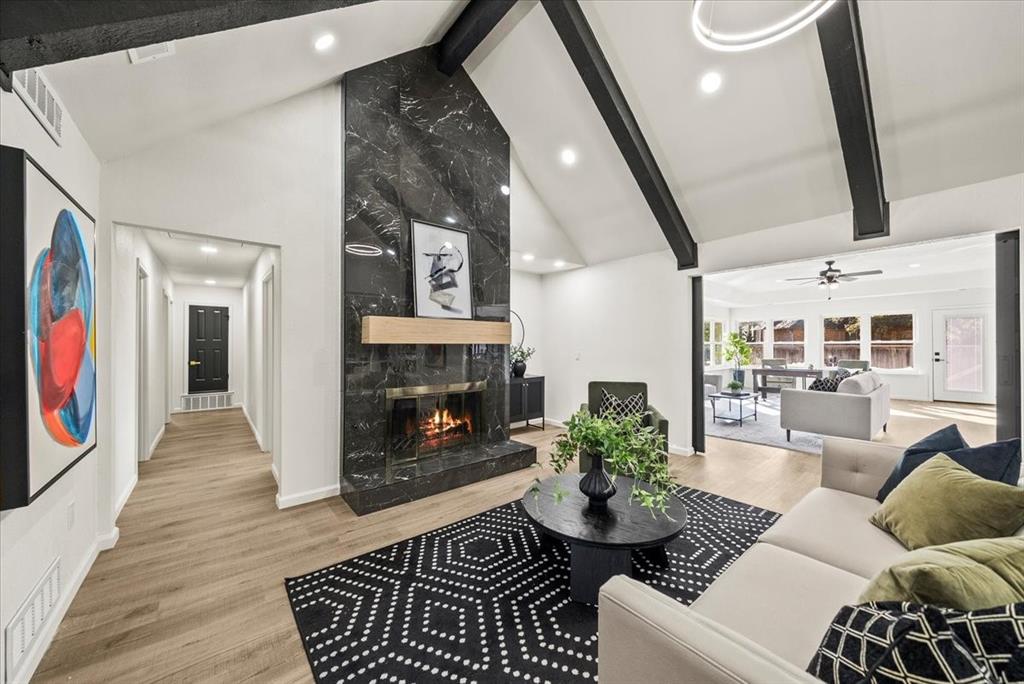 3609 Hidalgo Street Irving, TX 75062 - Photo 3 of 40 a living room with furniture and a fireplace