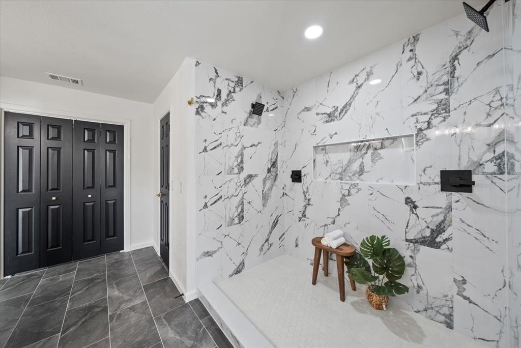 3609 Hidalgo Street Irving, TX 75062 - Photo 31 of 40 a bathroom with a bathtub and shower