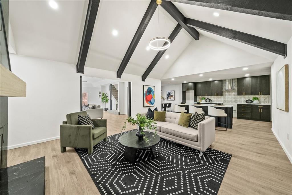 3609 Hidalgo Street Irving, TX 75062 - Photo 4 of 40 a living room with furniture a rug and kitchen view