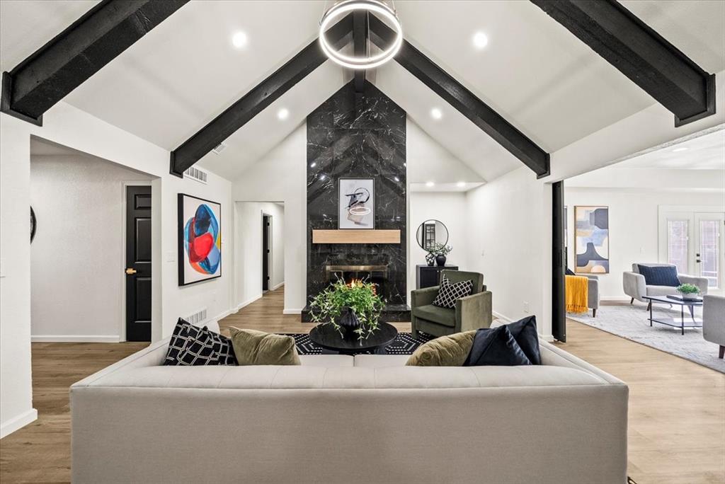 3609 Hidalgo Street Irving, TX 75062 - Photo 6 of 40 a living room with furniture and a chandelier
