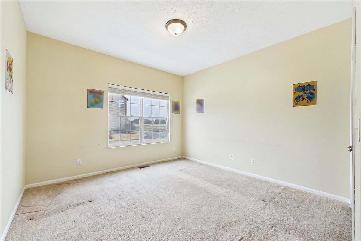 607 Clayton Circle, Unit 607 Sycamore, IL 60178 - Photo 12 of 48 an empty room with windows