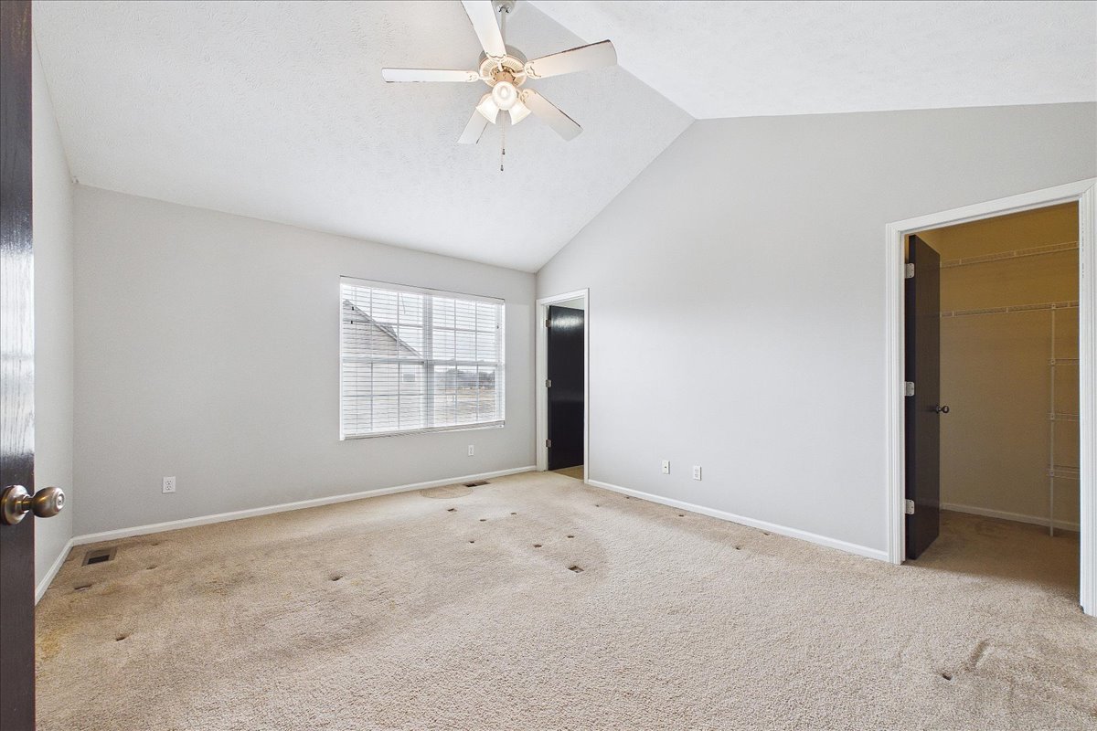 607 Clayton Circle, Unit 607 Sycamore, IL 60178 - Photo 15 of 48 an empty room with windows and fan