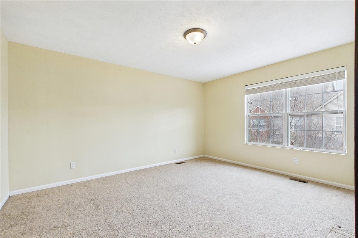 607 Clayton Circle, Unit 607 Sycamore, IL 60178 - Photo 20 of 48 a view of an empty room with a window