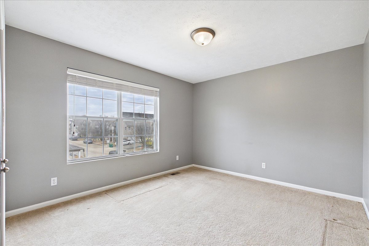 607 Clayton Circle, Unit 607 Sycamore, IL 60178 - Photo 22 of 48 an empty room with windows