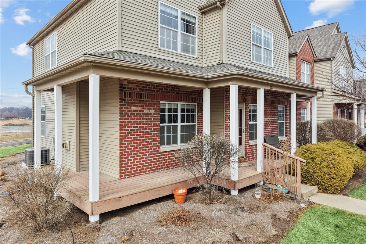 607 Clayton Circle, Unit 607 Sycamore, IL 60178 - Photo 26 of 48 a view of a house with a yard and sitting area