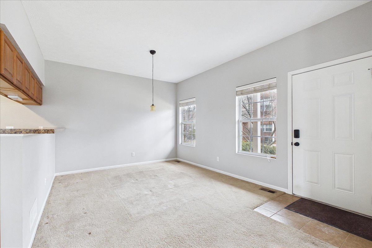 607 Clayton Circle, Unit 607 Sycamore, IL 60178 - Photo 6 of 48 an empty room with windows
