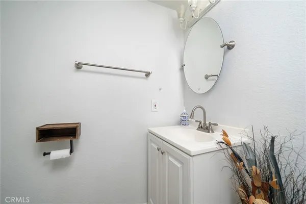 a bathroom with a sink and mirror