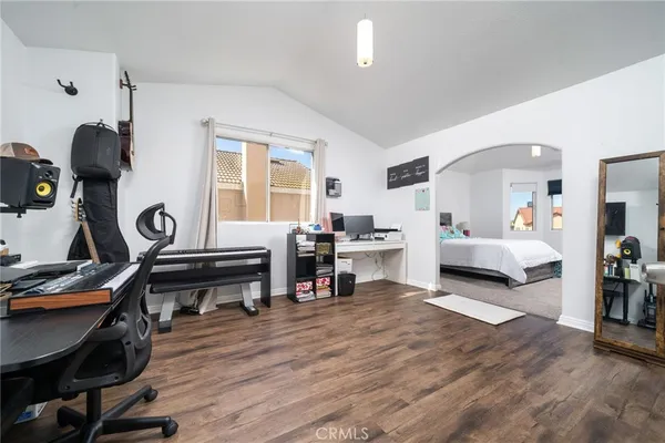 a bedroom with a bed and a walk in closet
