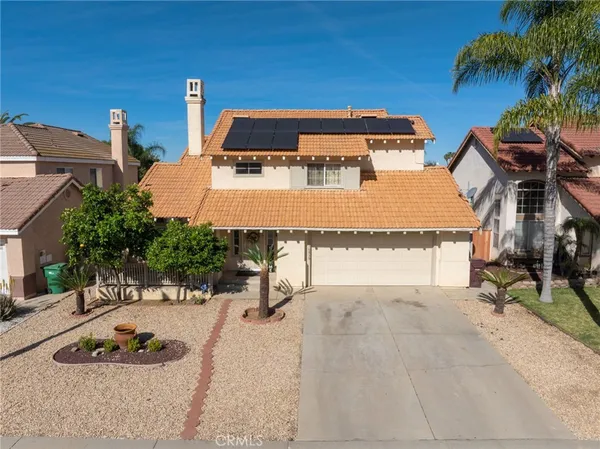 an aerial view of a house with swimming pool