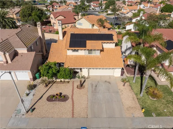 an aerial view of a house with outdoor space