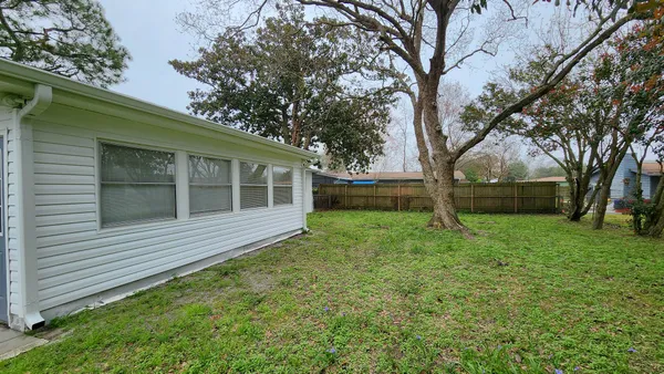 a view of a tree in front of a house