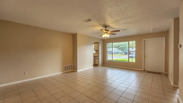 a view of an empty room with a window