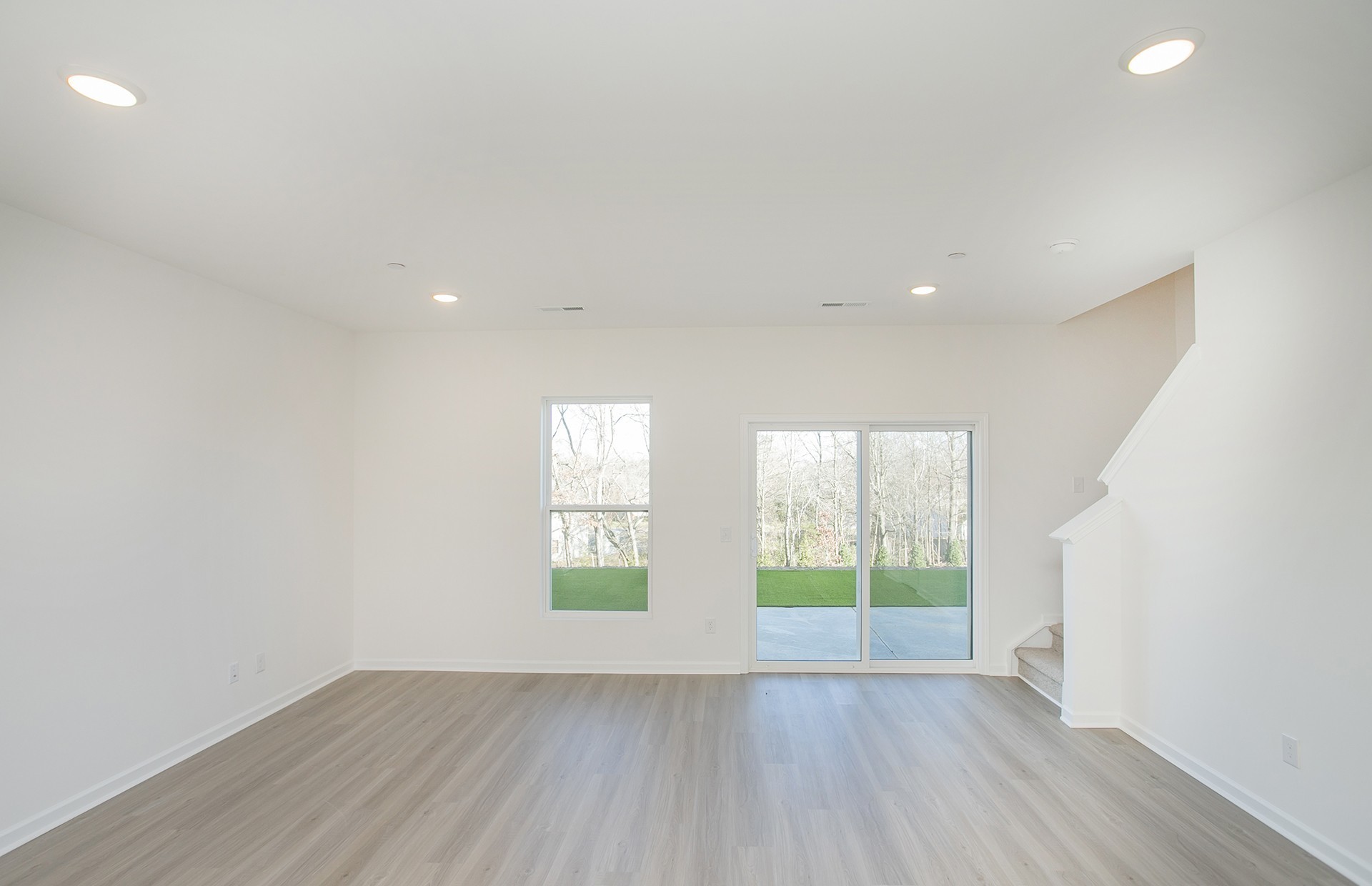 7129 Mapleside Lane Fairview, TN 37062 - Photo 10 of 49 an empty room with wooden floor and windows