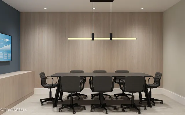 a dining room with furniture a window and kitchen view