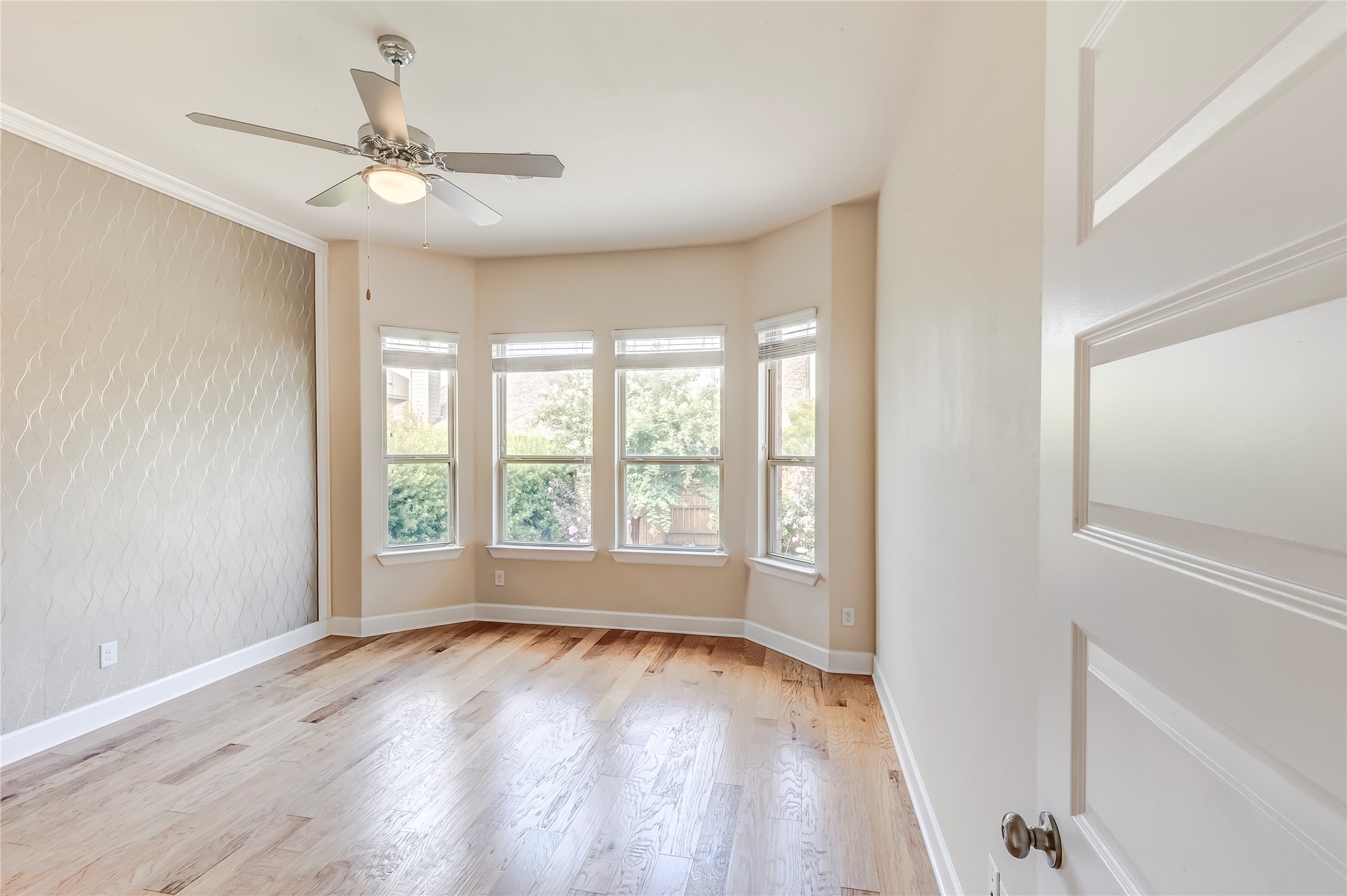 345 Fort Cobb Way Georgetown, TX 78628 - Photo 19 of 38 Hardwood floors and a wide bay window define this versatile interior space.