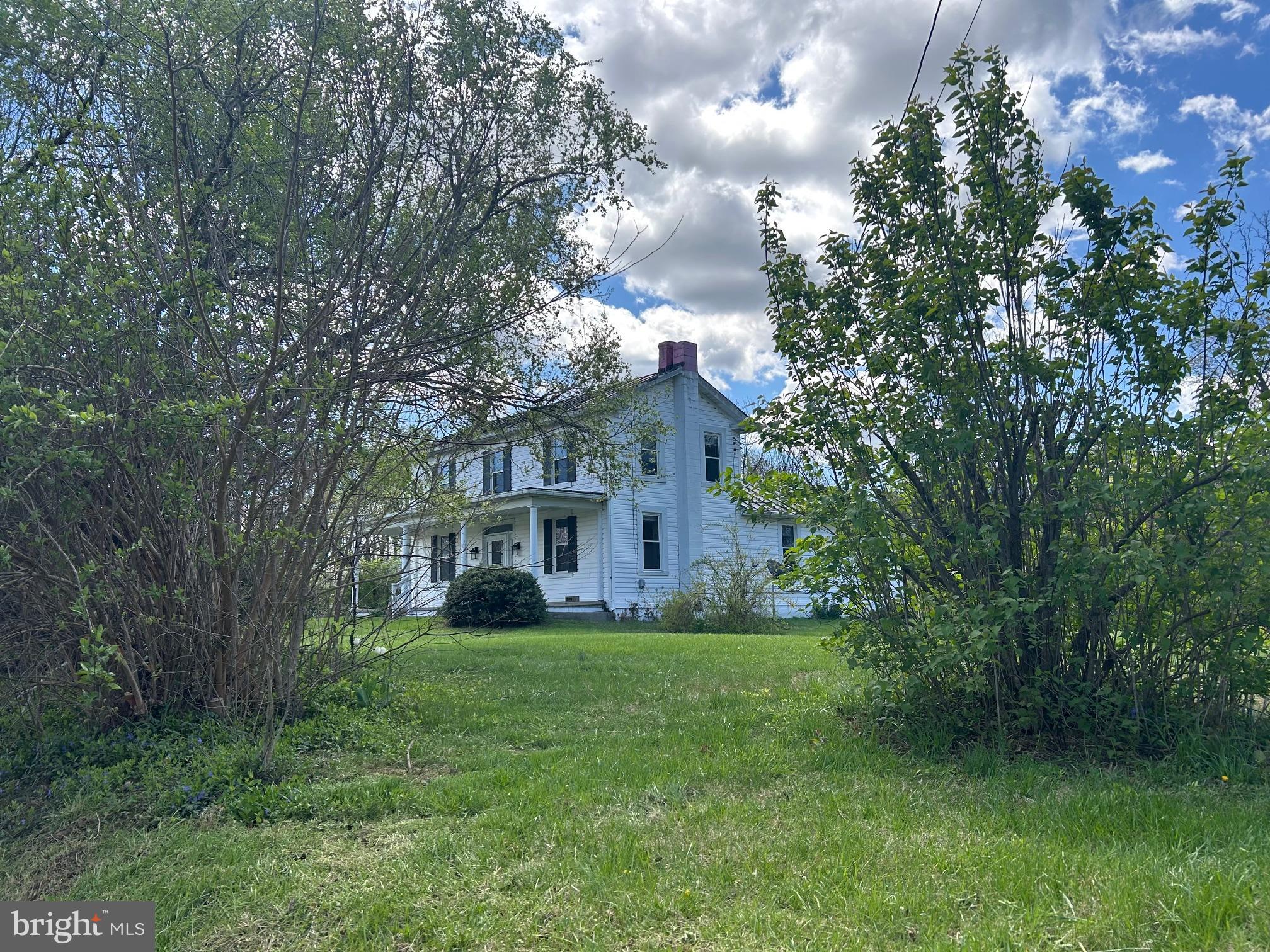 1095 Senseny Road Berryville, VA 22611 - Photo 1 of 47 a front view of house with yard and green space