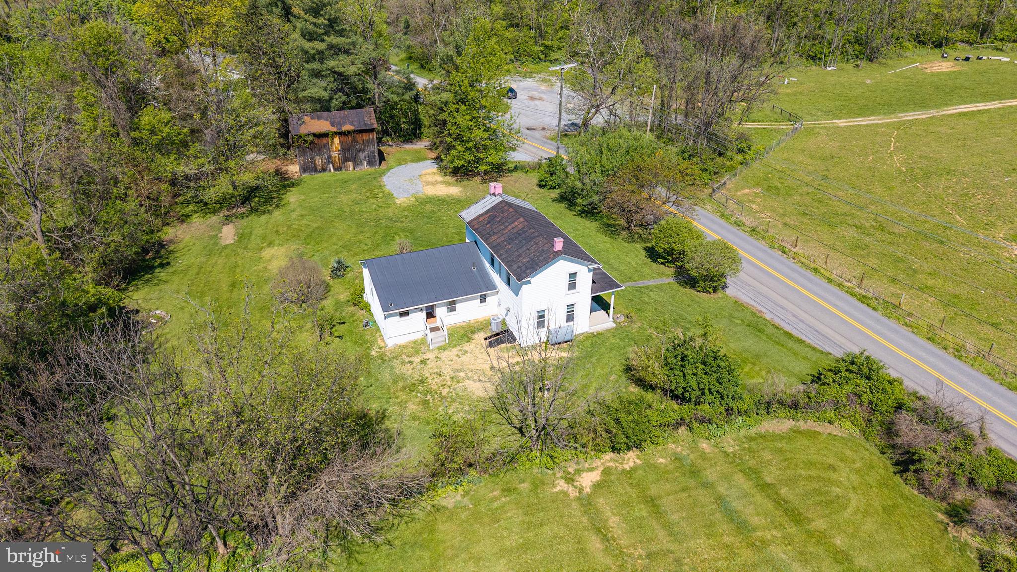 1095 Senseny Road Berryville, VA 22611 - Photo 42 of 47 a view of a lake with a garden