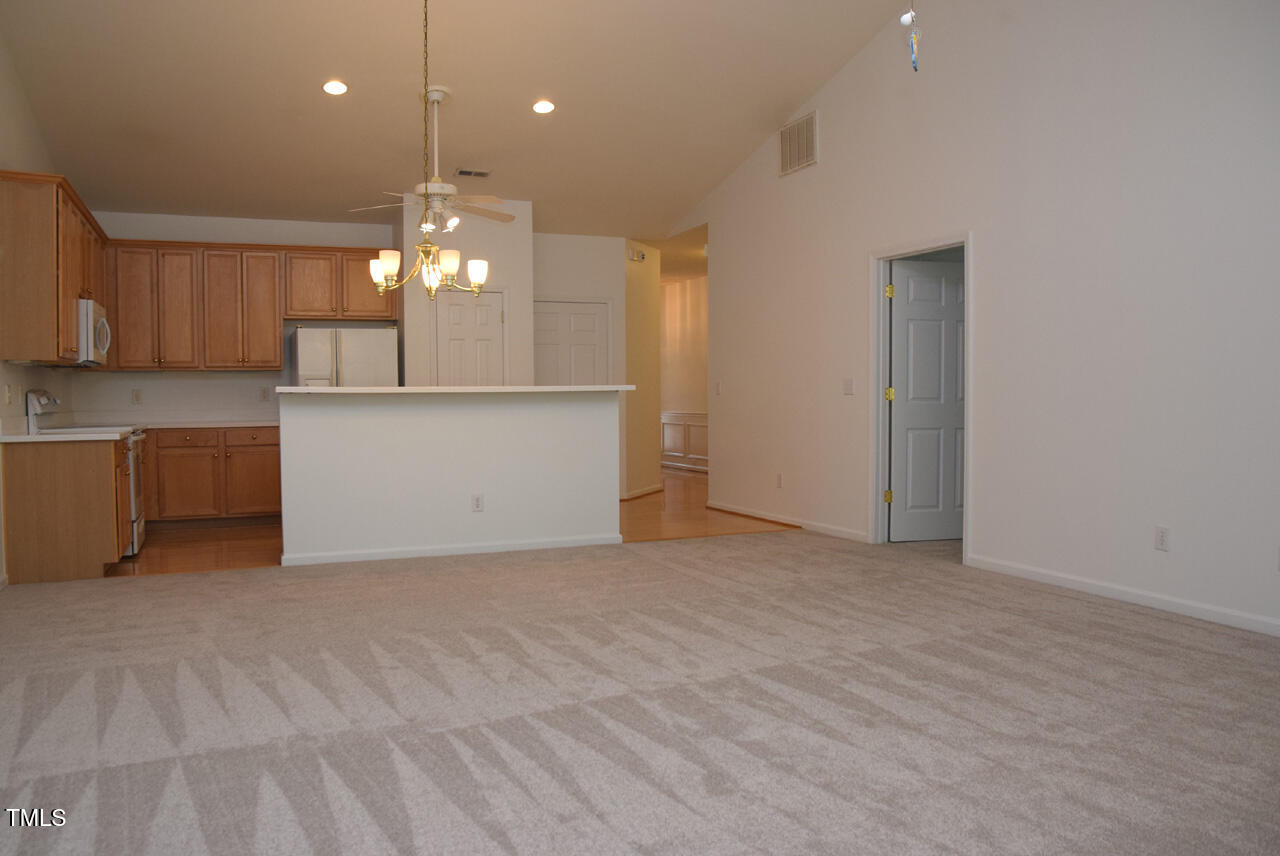 10461 Dapping Drive Raleigh, NC 27614 - Photo 11 of 29 a view of a kitchen with a sink and chandelier